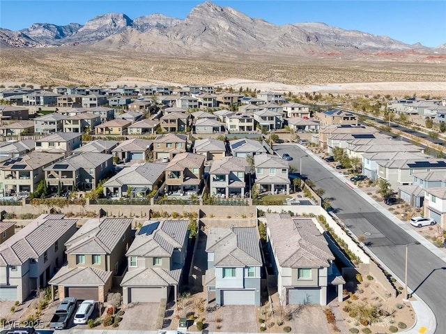 drone / aerial view featuring a mountain view