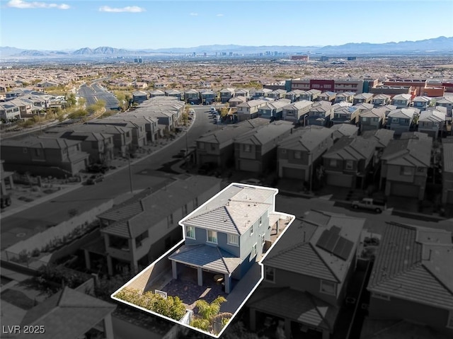 birds eye view of property featuring a mountain view