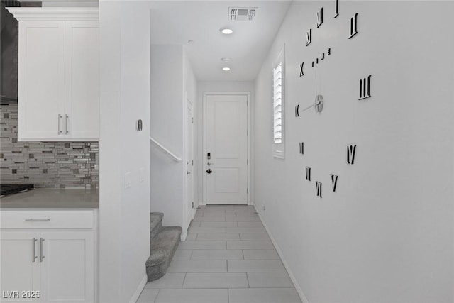 hallway with light tile patterned floors