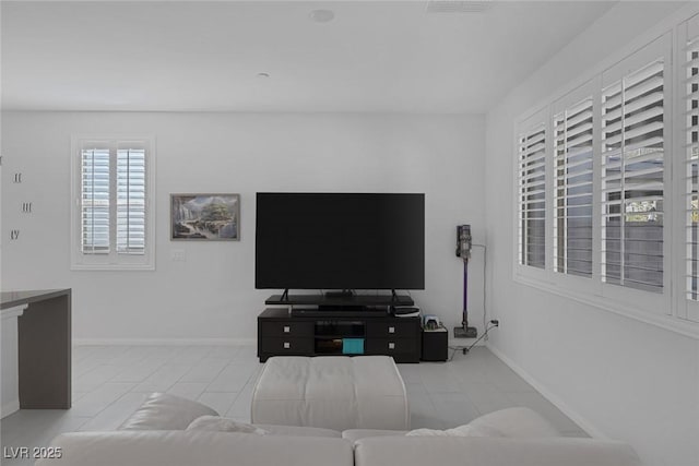 living room with light tile patterned floors