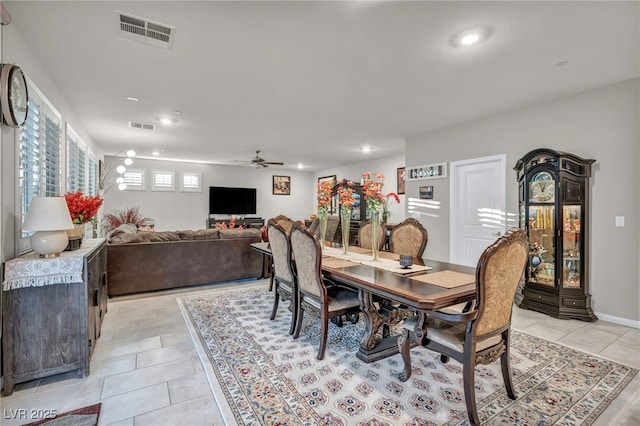 tiled dining area with ceiling fan