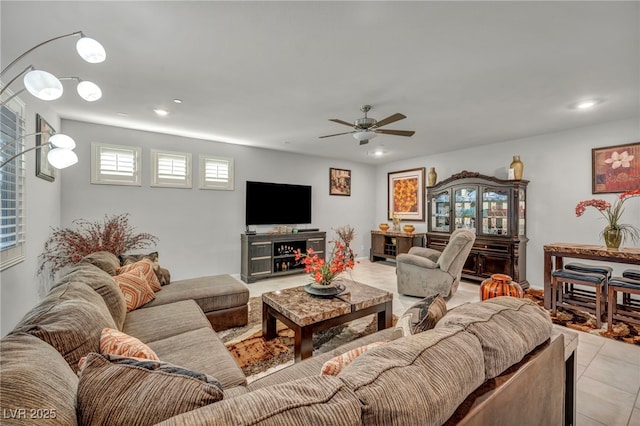 tiled living room featuring ceiling fan