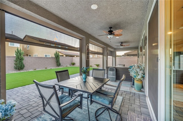 view of patio / terrace featuring ceiling fan