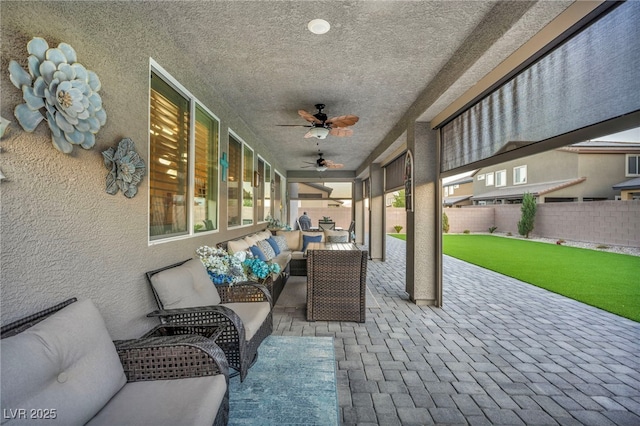 view of patio featuring ceiling fan and an outdoor hangout area