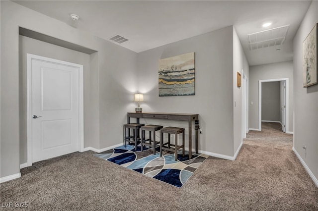 hallway featuring carpet flooring