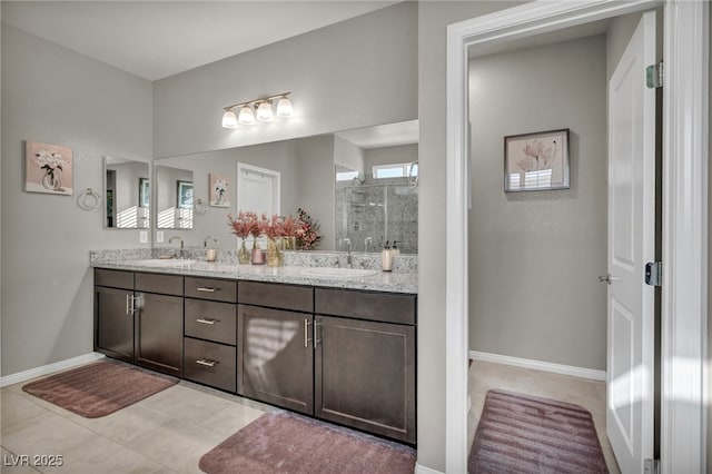 bathroom featuring an enclosed shower, vanity, and tile patterned flooring