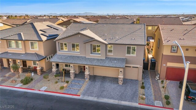 view of front of home featuring a mountain view and a garage