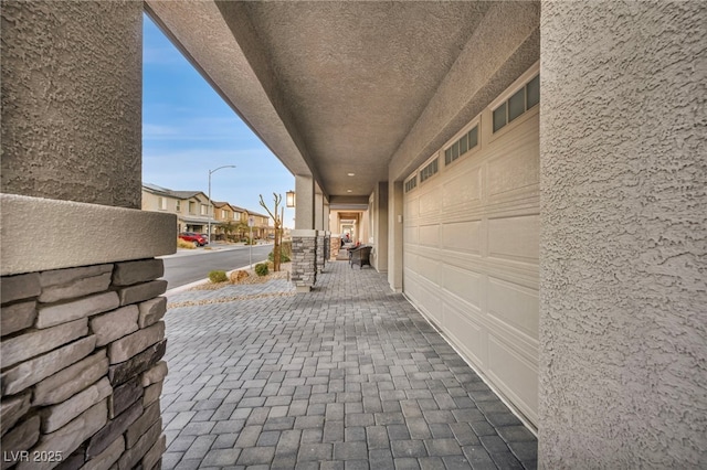 view of patio / terrace featuring a garage