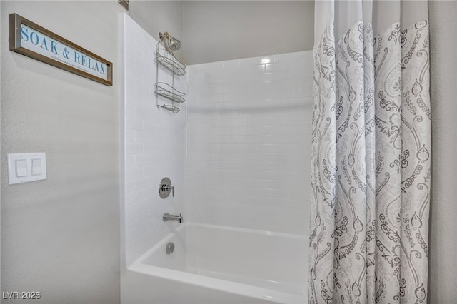 bathroom with shower / tub combo