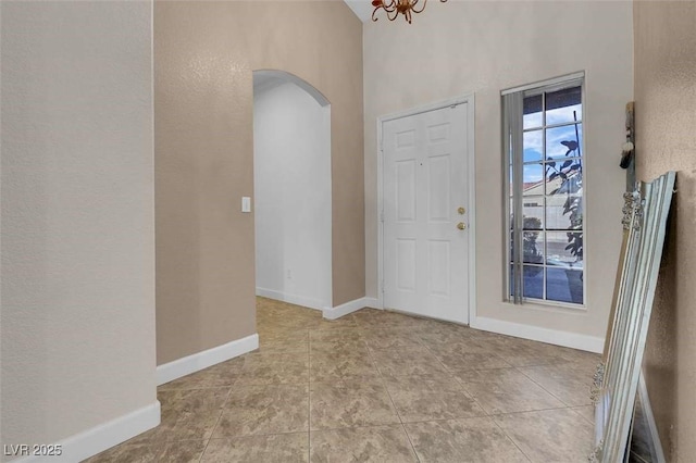 entrance foyer with a notable chandelier