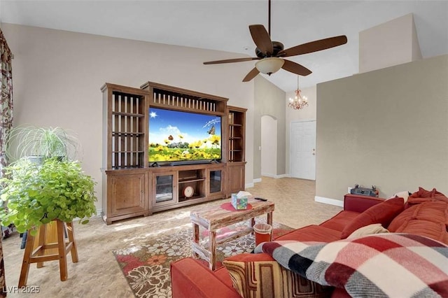 living room featuring ceiling fan with notable chandelier and high vaulted ceiling