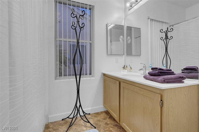 bathroom featuring vanity, a shower with curtain, and tile patterned flooring