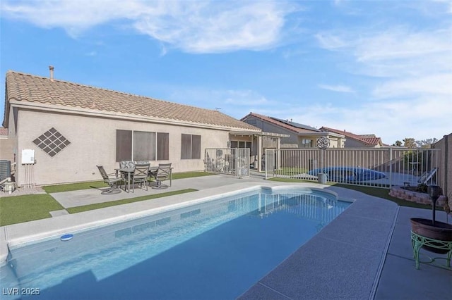 view of pool with central air condition unit and a patio