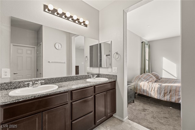 bathroom featuring tile patterned flooring and vanity