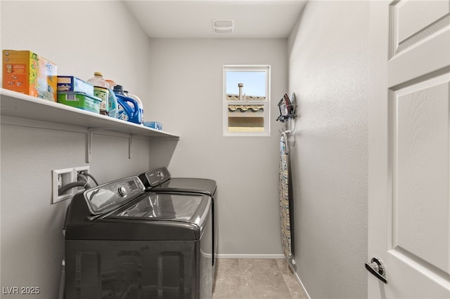 laundry room with washing machine and dryer