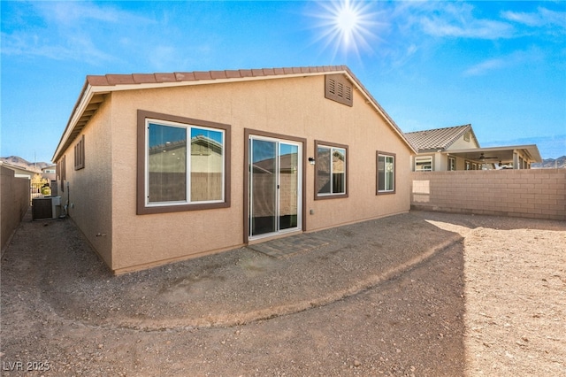 rear view of property with central air condition unit