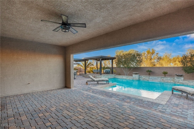 view of swimming pool featuring pool water feature and a patio area