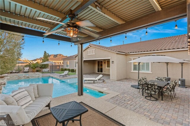 view of swimming pool featuring an in ground hot tub, a patio area, and ceiling fan