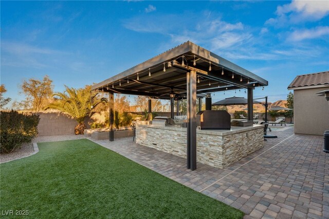 view of patio / terrace featuring grilling area and exterior kitchen