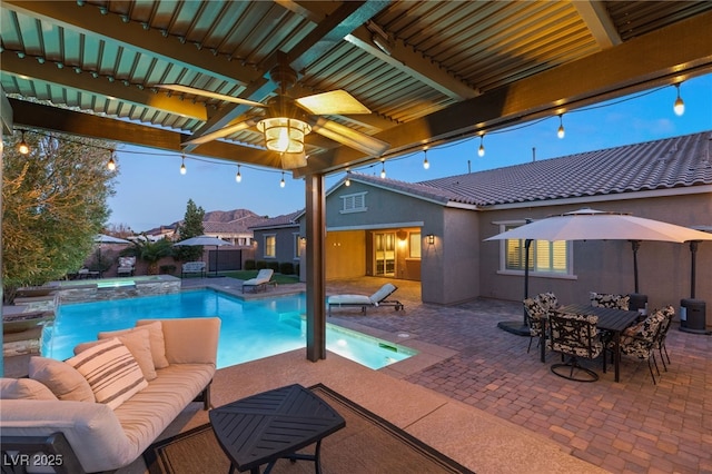 view of swimming pool with ceiling fan, a patio area, and outdoor lounge area