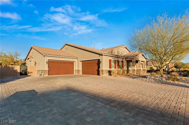 mediterranean / spanish house featuring a garage