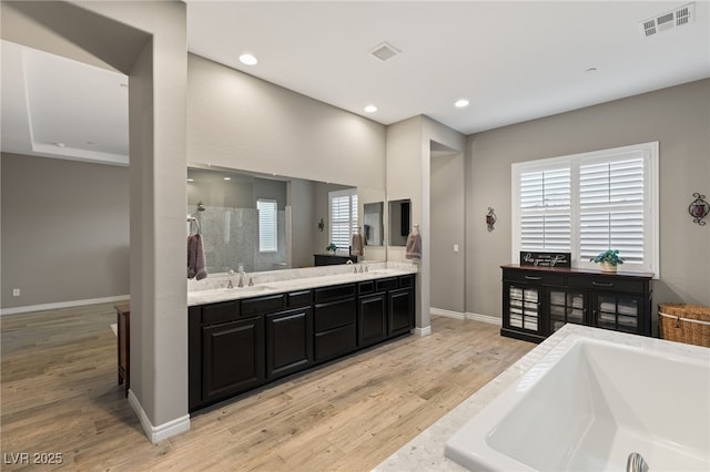 kitchen featuring light wood-type flooring and sink