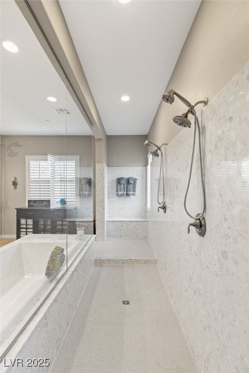 bathroom with tiled shower