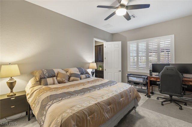 bedroom featuring ceiling fan and light colored carpet