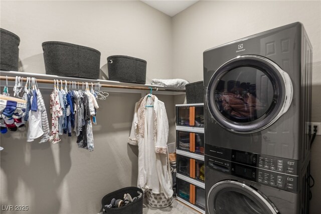 laundry room with stacked washer and clothes dryer