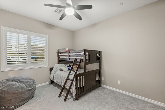 bedroom featuring ceiling fan and light colored carpet