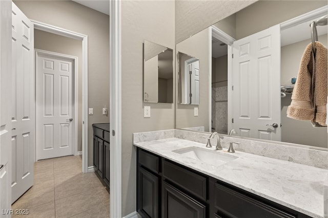 bathroom featuring tile patterned floors and vanity