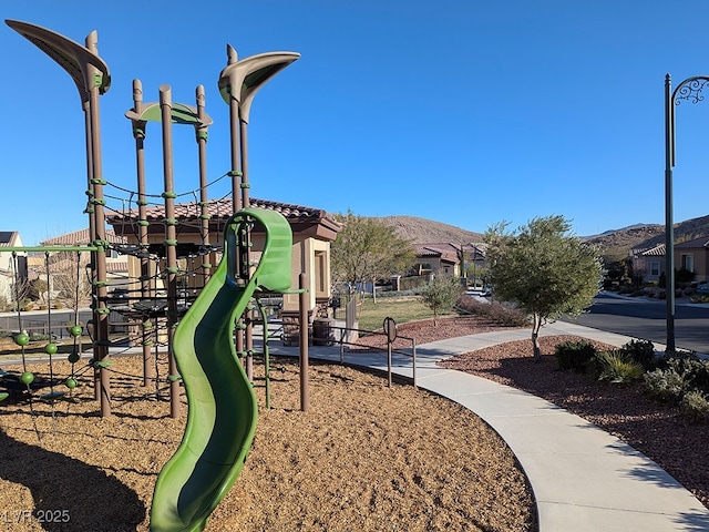 view of playground featuring a mountain view