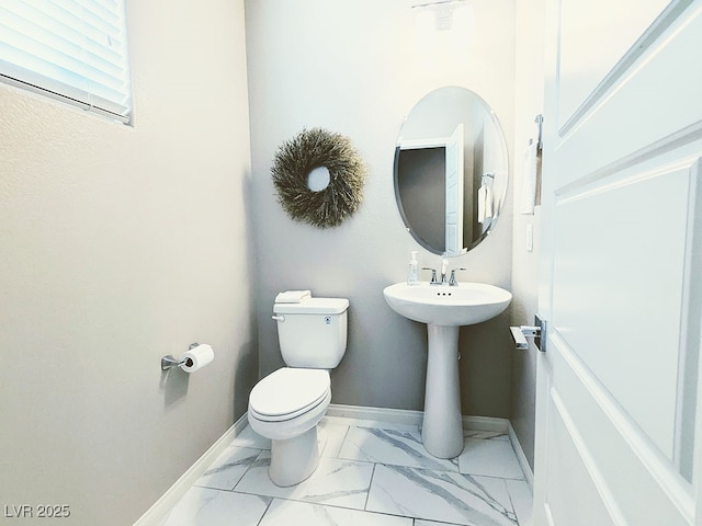 bathroom featuring toilet