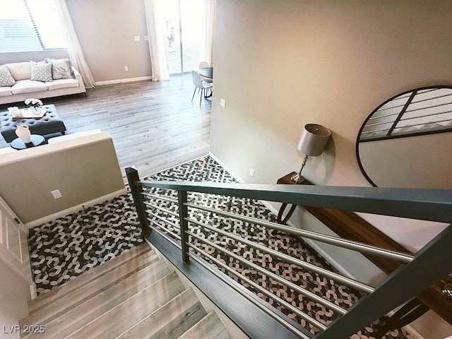 stairs featuring hardwood / wood-style flooring