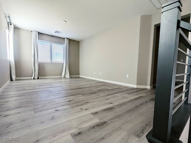 unfurnished room featuring light wood-type flooring