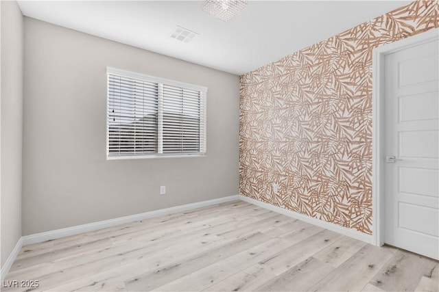 unfurnished room featuring light wood-type flooring