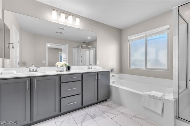 bathroom featuring vanity and plus walk in shower