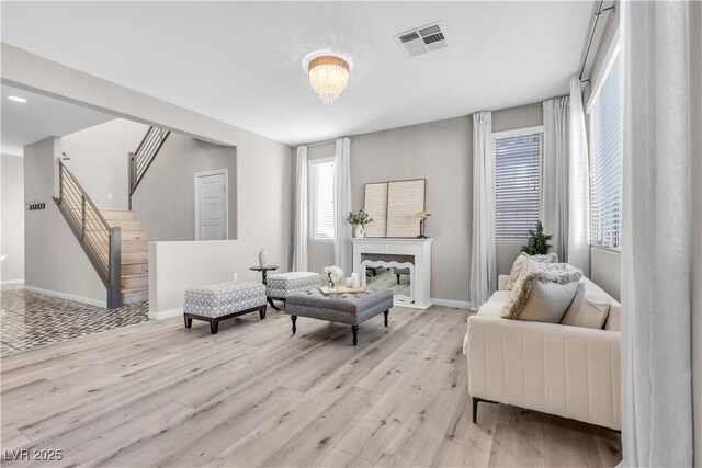 living room with light hardwood / wood-style floors