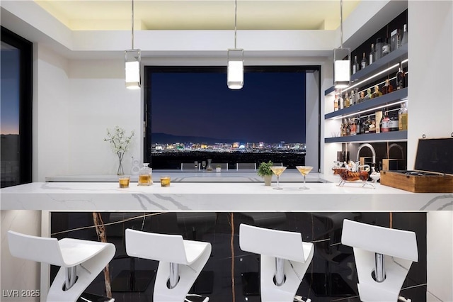 bar with hanging light fixtures