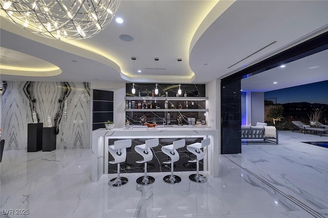 bar featuring a tray ceiling