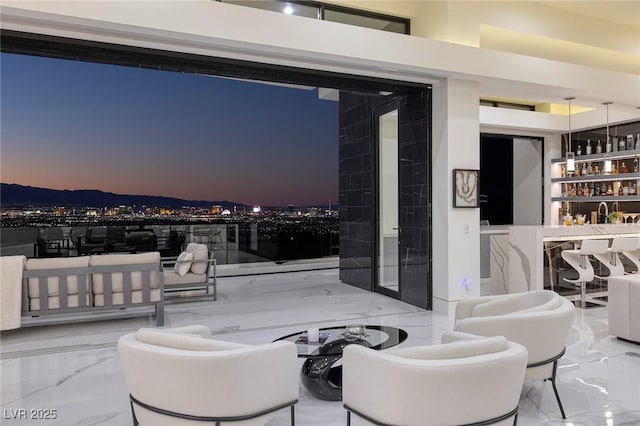 view of patio terrace at dusk