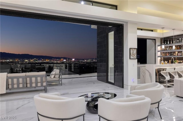 view of patio terrace at dusk