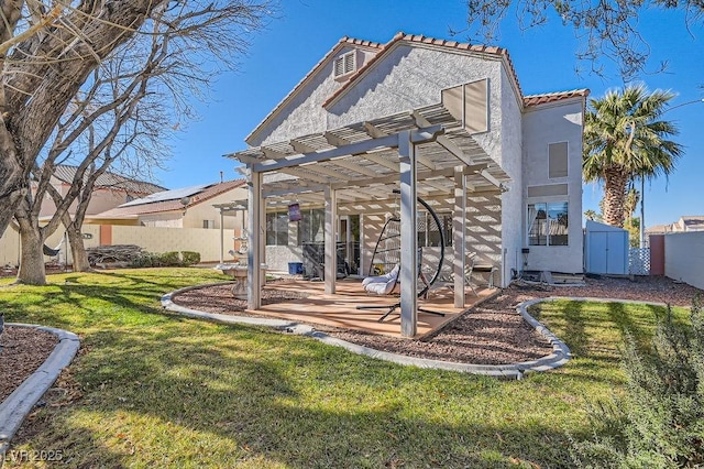 back of property featuring a lawn, a shed, a pergola, and a patio area