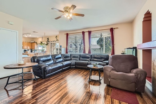 living room with hardwood / wood-style flooring and ceiling fan