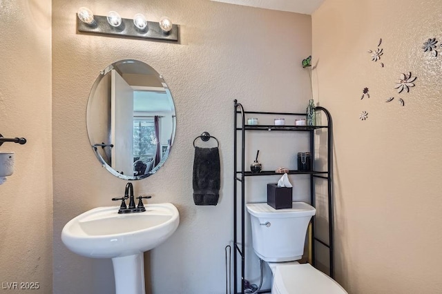 bathroom with sink and toilet