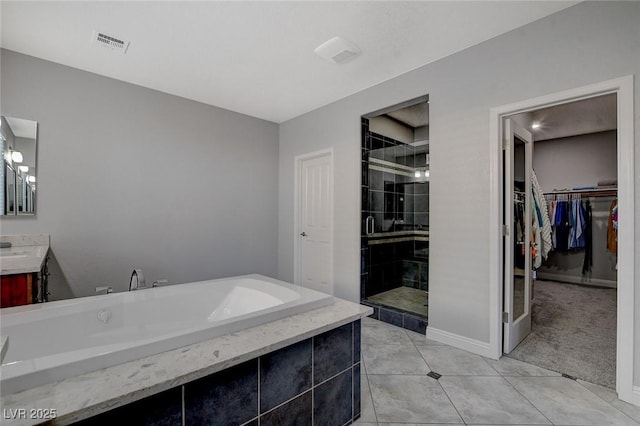 bathroom with vanity, tile patterned flooring, and independent shower and bath