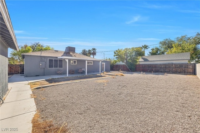 back of property with a patio area