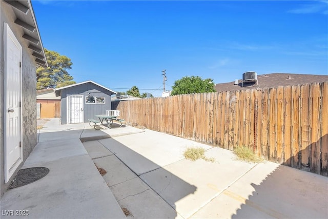 view of patio / terrace featuring a storage unit