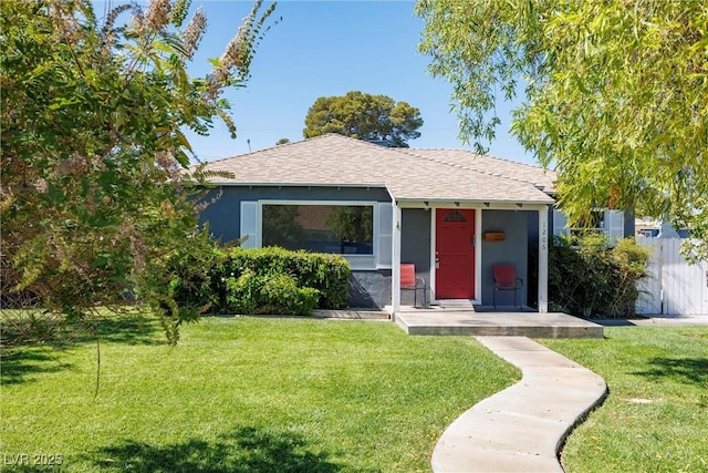 bungalow-style home featuring a front lawn