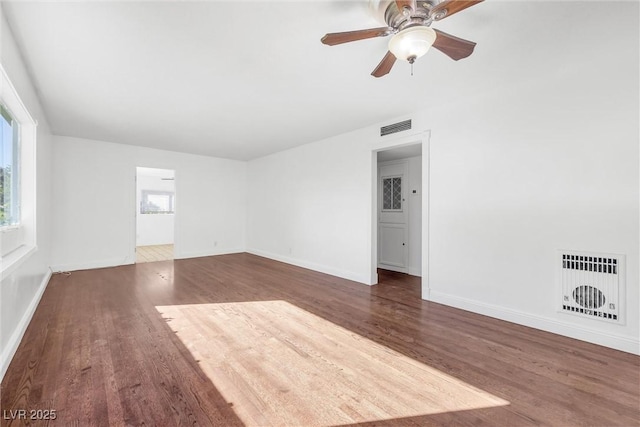 spare room with ceiling fan and dark hardwood / wood-style flooring